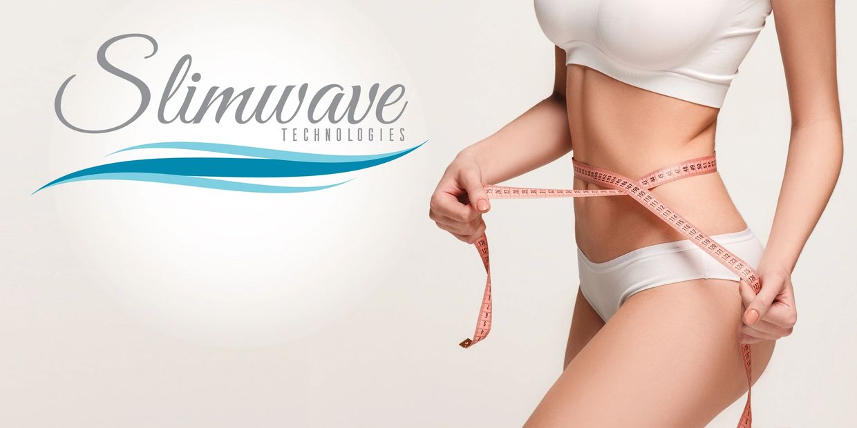 Slim woman wrapping measuring tape around abdomen by Slimwave Technologies